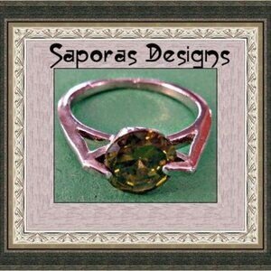 Size 5 Silver Tone Ring With Green Crystal
